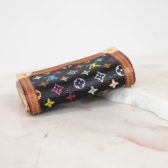 Wallet with multicolored patterns on a white surface