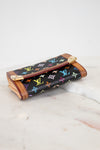 Louis Vuitton wallet with multicolor monogram pattern on a marble surface