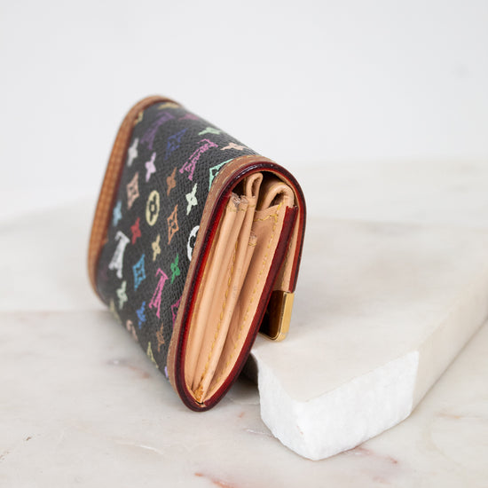 Small wallet with colorful pattern on a marble surface