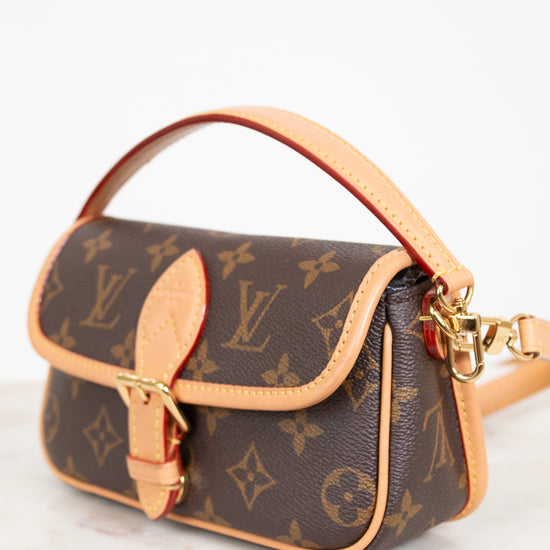 Louis Vuitton handbag with monogram pattern on a white background