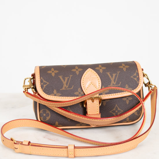 Designer handbag with monogram pattern on a white background