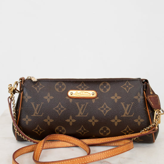 Designer handbag with monogram pattern on a white background