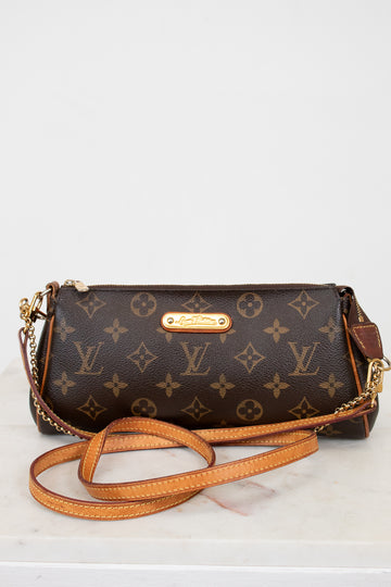 Designer handbag with monogram pattern on a white background