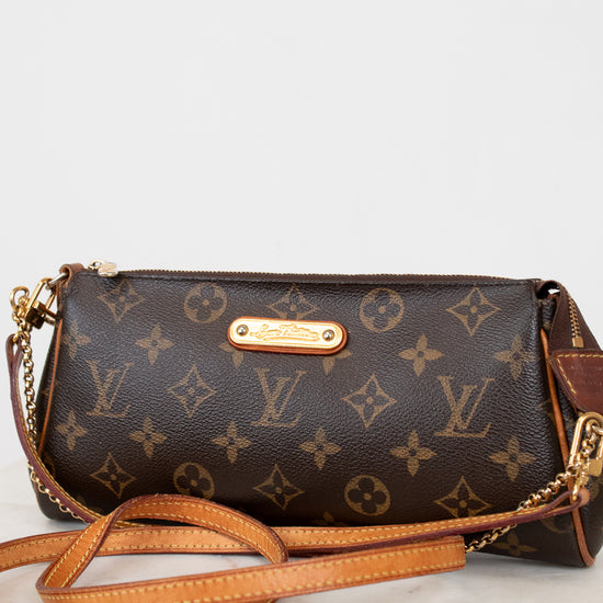 Louis Vuitton handbag with monogram pattern on a white background