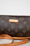 Louis Vuitton handbag with monogram pattern on a light background