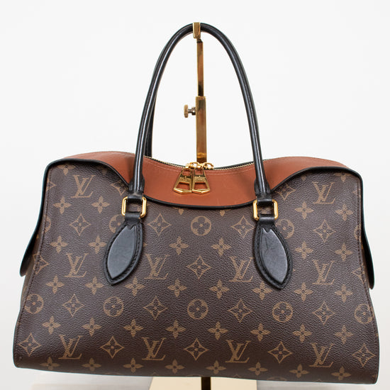 Louis Vuitton handbag with monogram pattern on a white background