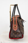 Designer handbag with monogram pattern on a white background