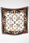 Louis Vuitton scarf with intricate design and logo on a white background