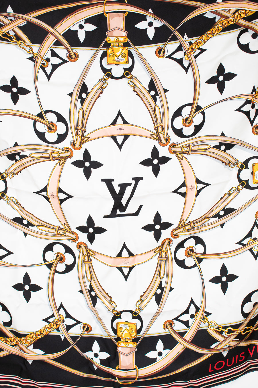Louis Vuitton scarf with brand logo and decorative patterns