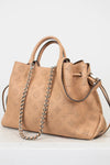 Beige handbag with chain detail on a white background
