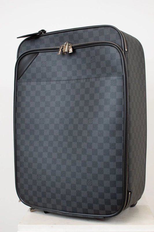 Checkered patterned suitcase on a white background
