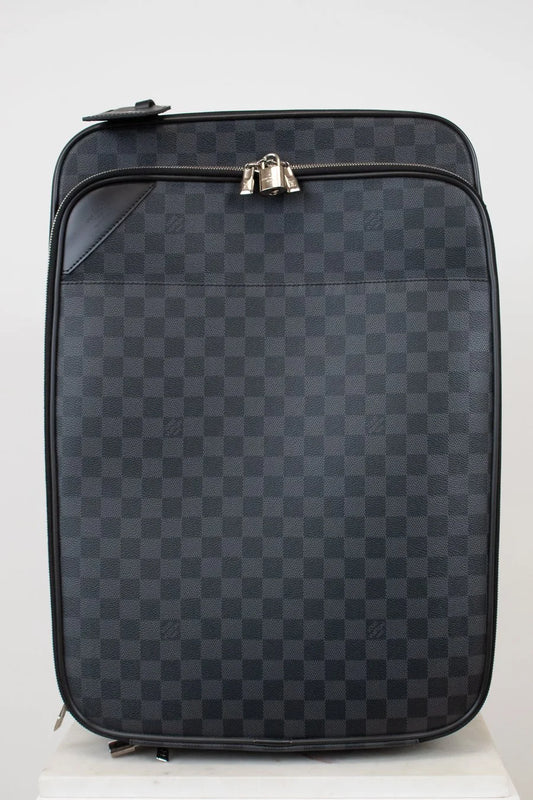 Black checkered suitcase with silver zippers on a white background