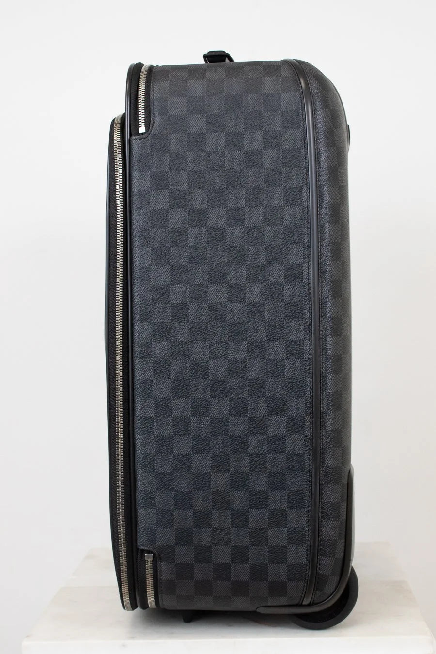 Black checkered suitcase on a white background