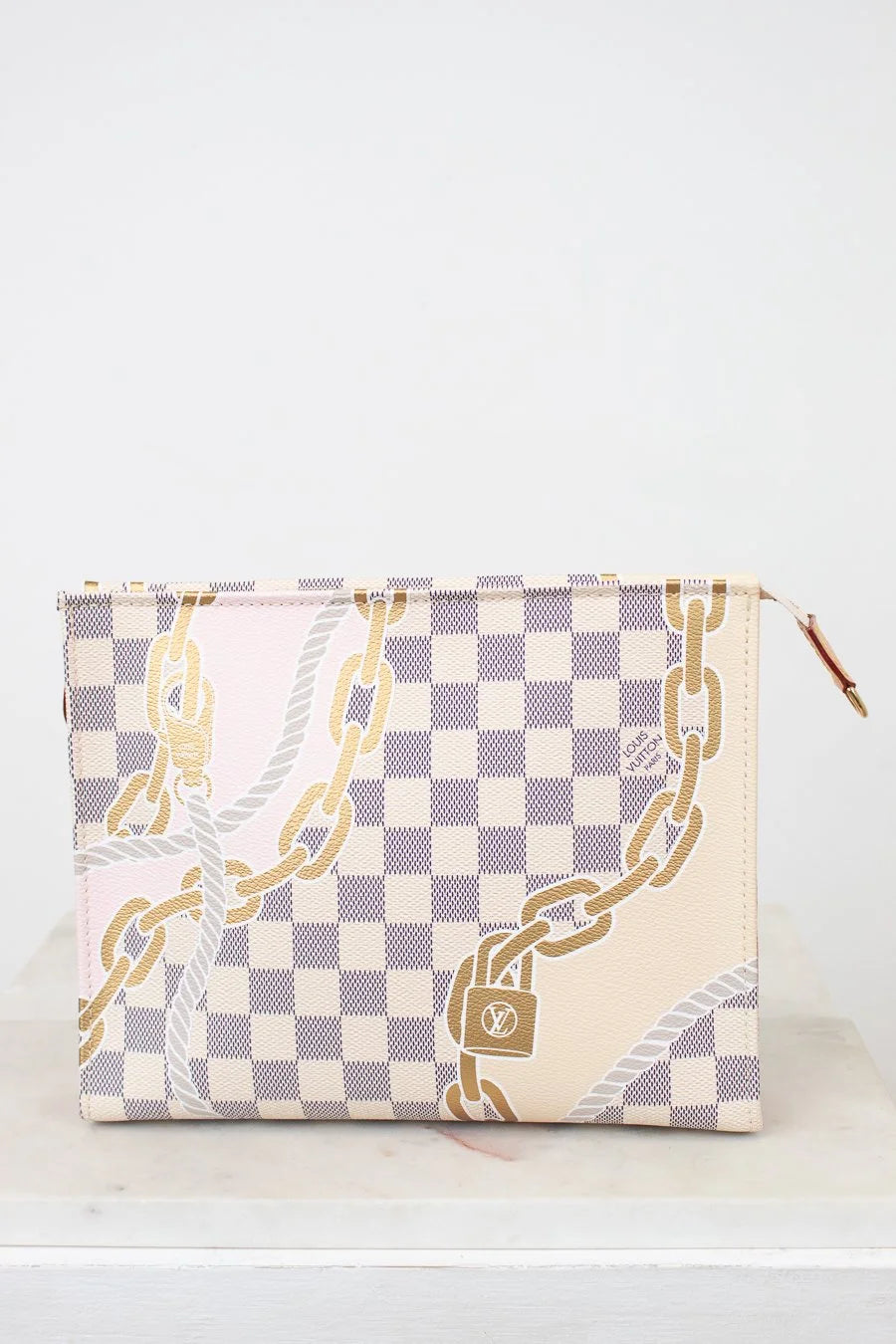 Checkered pouch with chain design on a white background