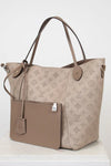 Beige handbag with monogram pattern on a white background