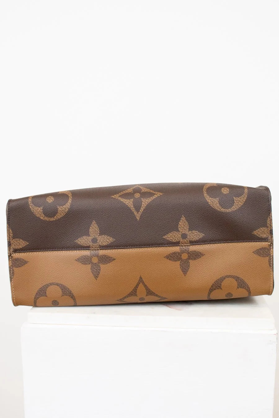 Brown and beige wallet with a pattern on a white background