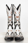 A pair of white western cowboy boots with black and brown leather details, shown from the front against a plain white background.