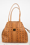 Tan handbag with brand logo on a white background