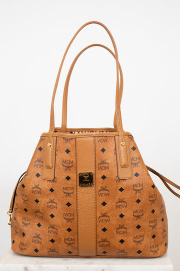 Tan handbag with brand logo on a white background