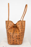 Tan leather handbag with visible brand logo on a white background