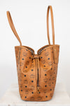 Brown leather handbag with visible brand logo on a white background