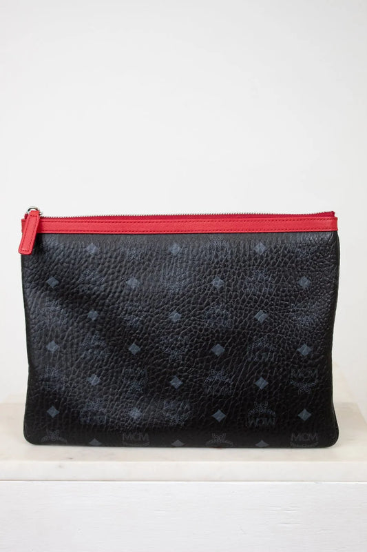 Black textured pouch with a red zipper on a white background