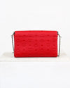 Red handbag with a chain strap on a white background