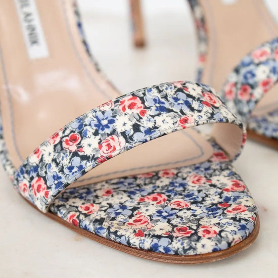 Floral print sandal with 'Manolo Blahnik' label on a white background