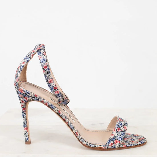 Floral high-heeled sandal on a white background