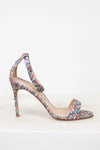 Floral high-heeled sandal on a white background