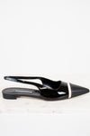 Black patent leather slingback shoes with a pointed toe on a white background