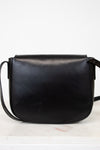 Black leather saddle bag on a white background