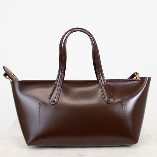Brown leather handbag on a white background