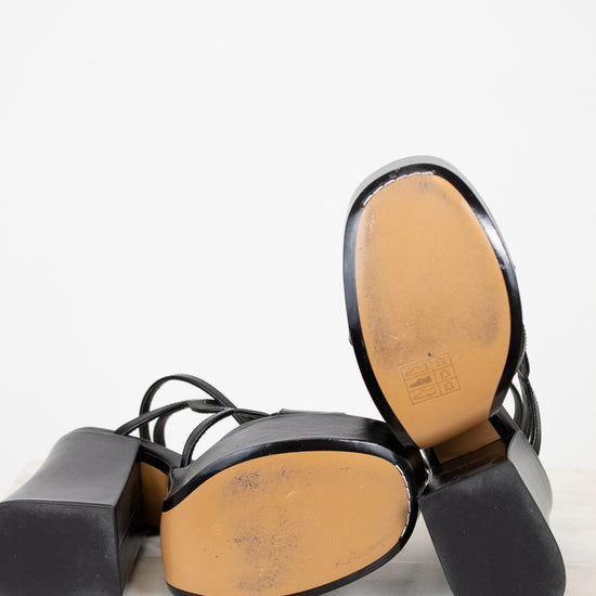 Black and brown shoe insole on a white background