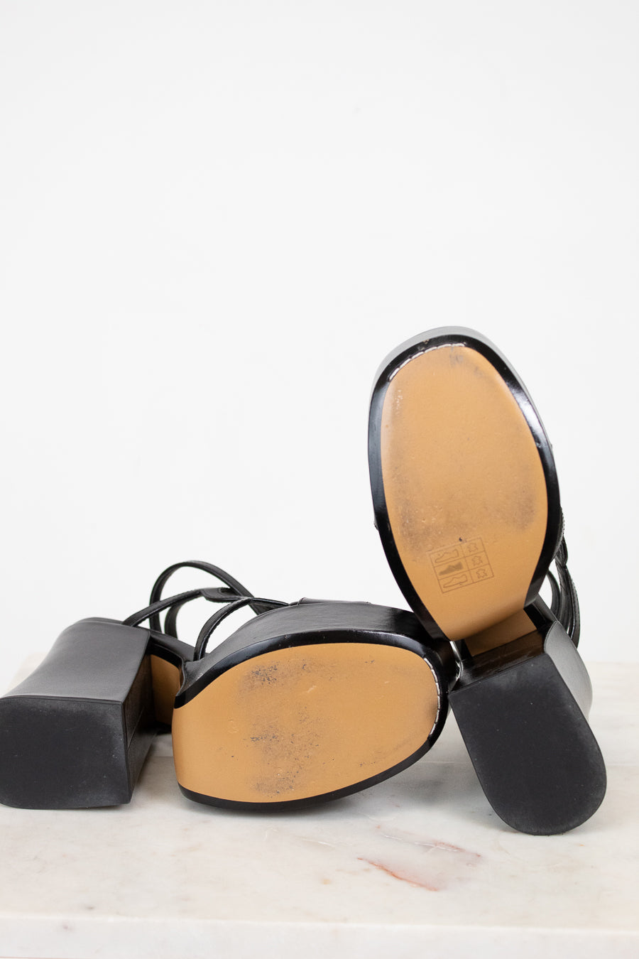 Black and brown shoe insole on a white background