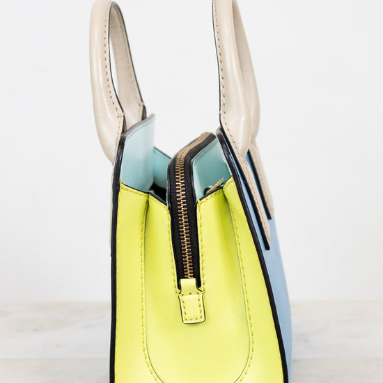 Colorful handbag with a zipper on a light background