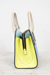 Colorful handbag with a zipper on a light background