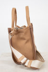 Brown and beige bag with straps on a white background
