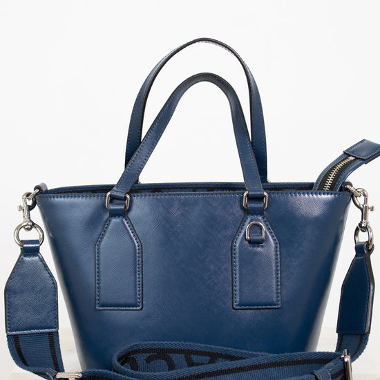 Blue handbag with a visible brand logo on a white background