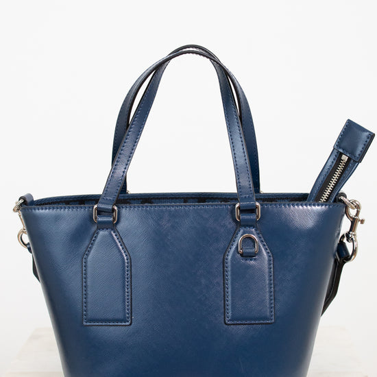 Blue handbag with 'Marc Jacobs' branding on a white background