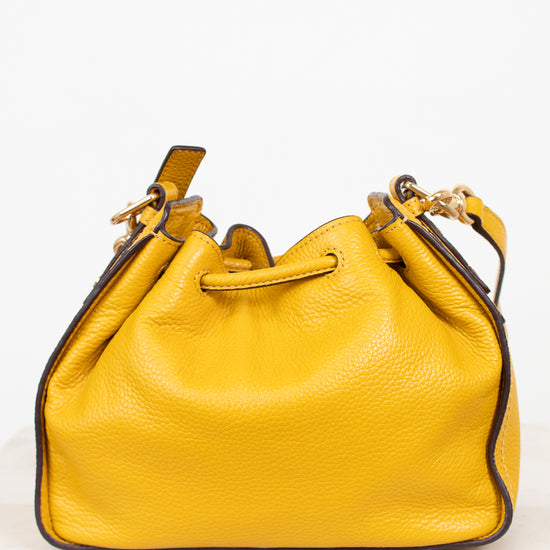 Yellow leather handbag on a white background