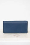Back of Blue wallet on a white marble surface