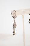 Back of earrings showing silver back on a white background