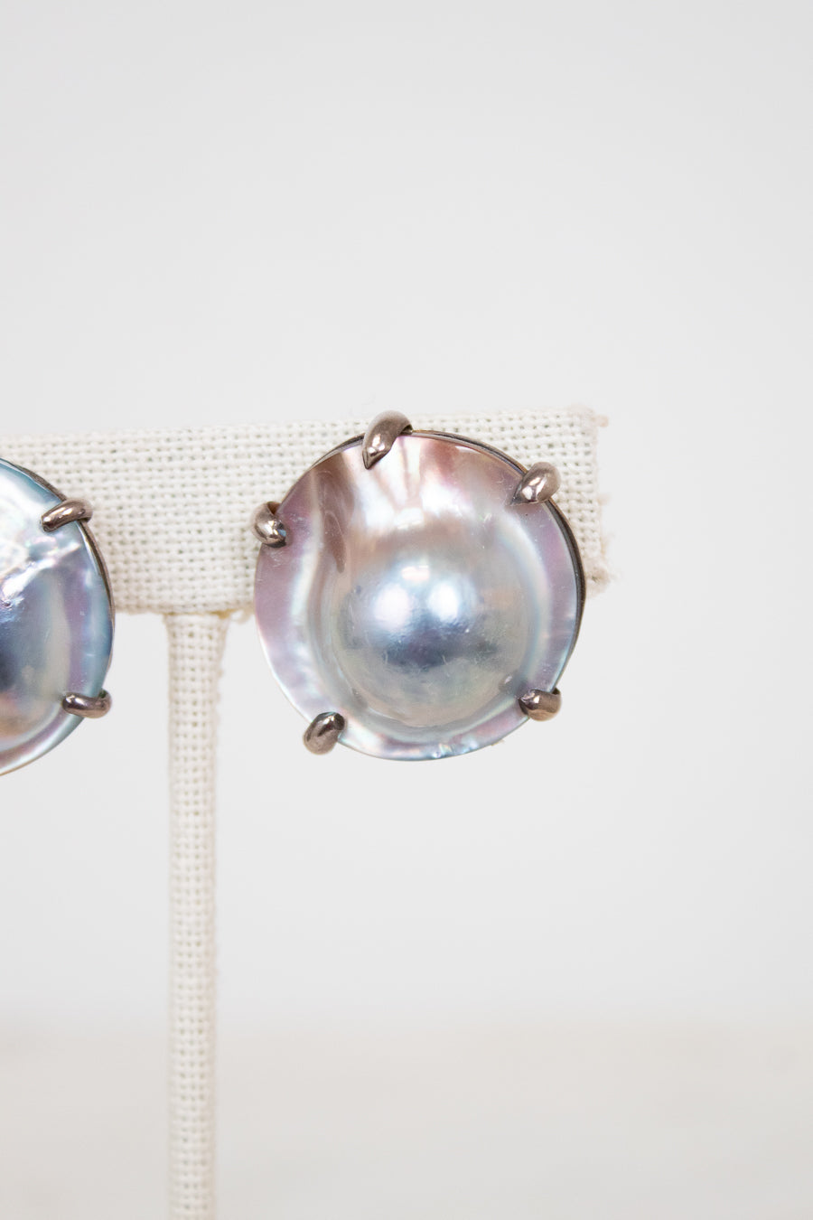 Pair of silver earrings on a white background