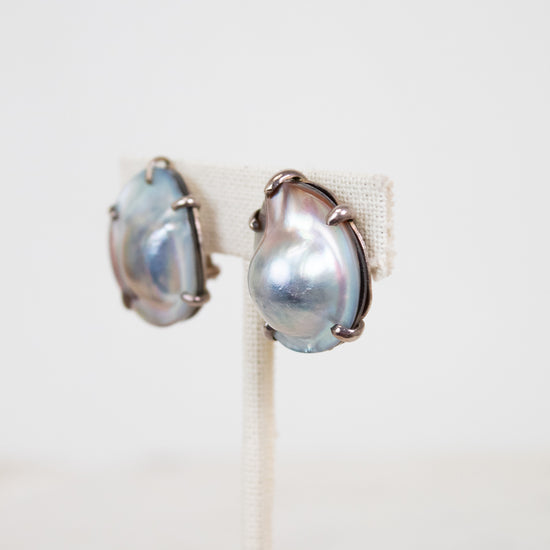 Pair of pearl earrings on a white background