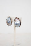 Pair of pearl earrings on a white background