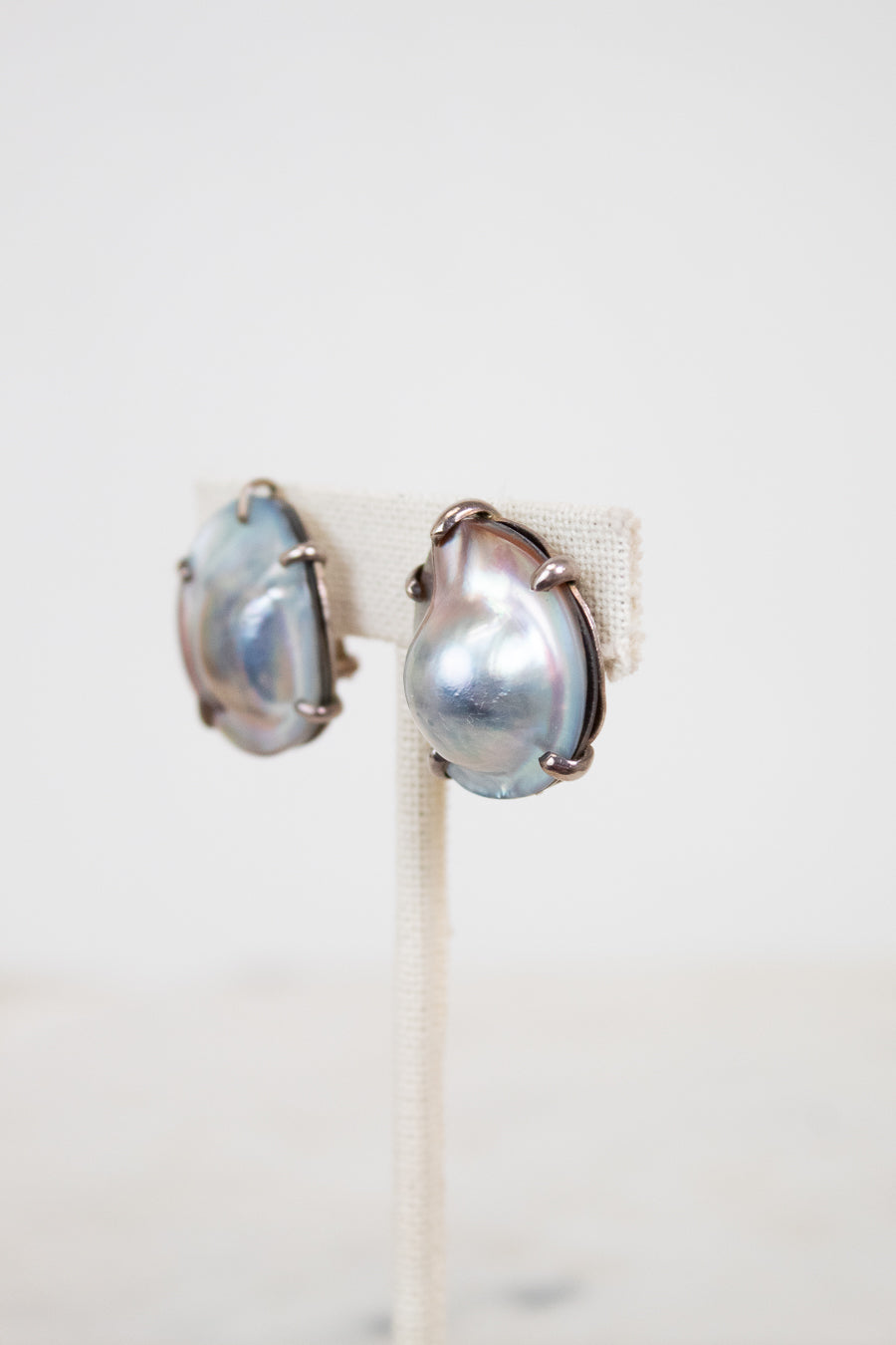 Pair of pearl earrings on a white background