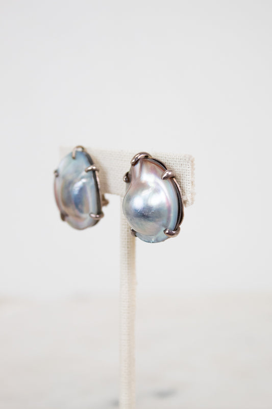 Pair of pearl earrings on a white background