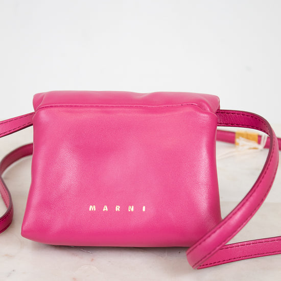 Pink handbag with 'Marni' branding on a marble surface