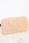 A light beige woven straw pouch with a ribbed texture, resting on a white marble surface against a white background.